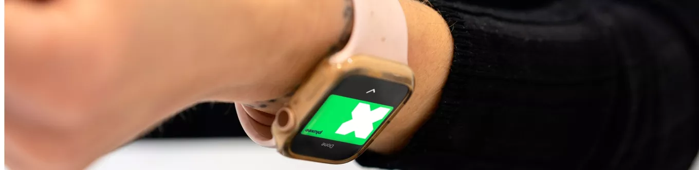 paying at counter with pluxee card on watch  