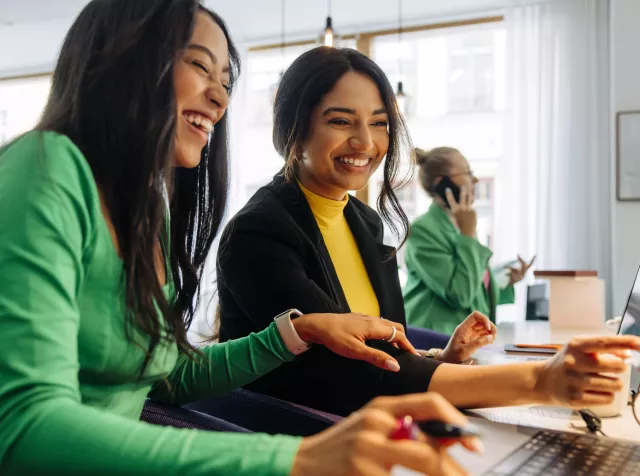 Women working together in an office